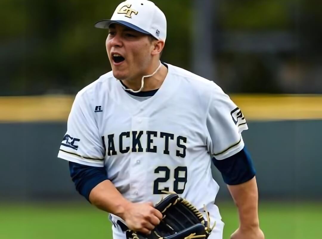 A baseball player is running on a field.